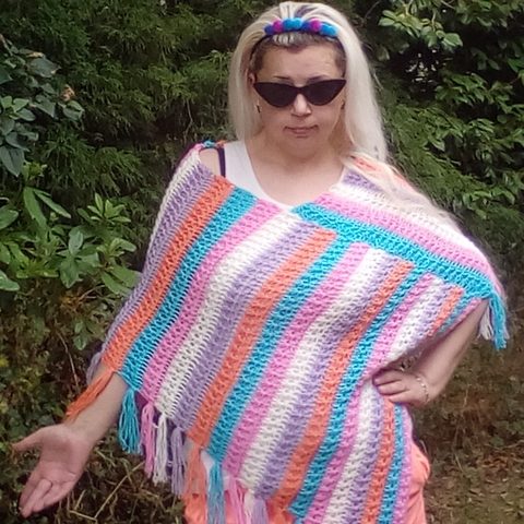 Rainbow Star: striped crochet poncho in pastel colours