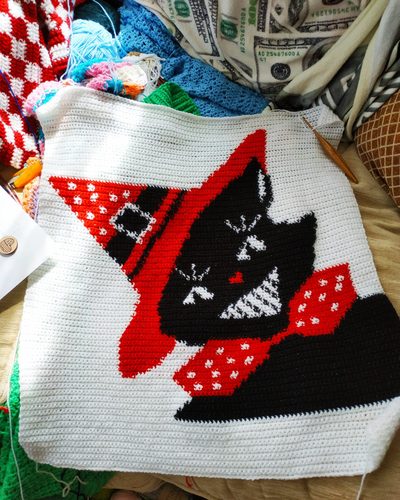 The cushion cover styled among other crochet pieces